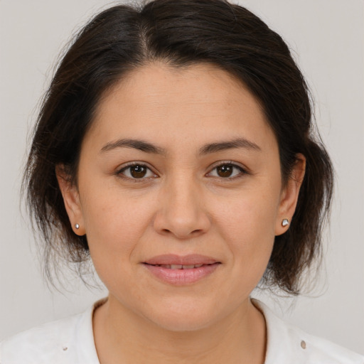 Joyful white adult female with medium  brown hair and brown eyes