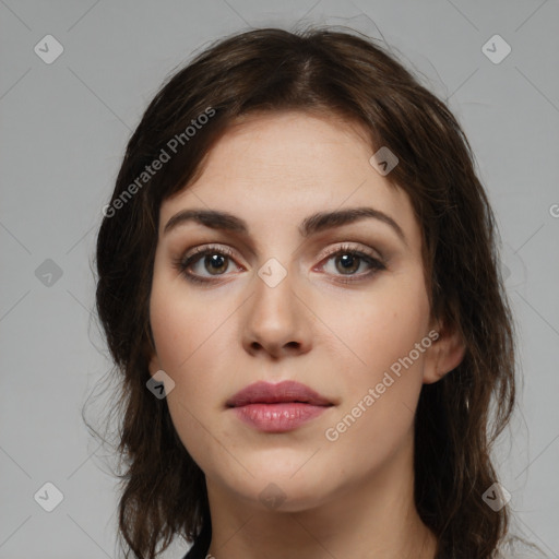 Neutral white young-adult female with long  brown hair and brown eyes