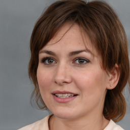 Joyful white young-adult female with medium  brown hair and brown eyes