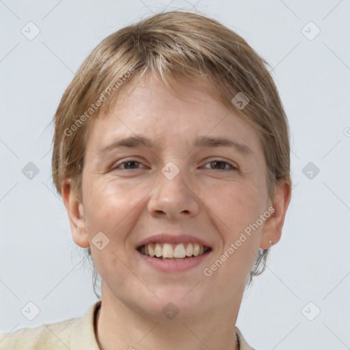 Joyful white young-adult female with short  brown hair and grey eyes