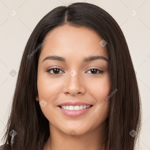 Joyful latino young-adult female with long  brown hair and brown eyes