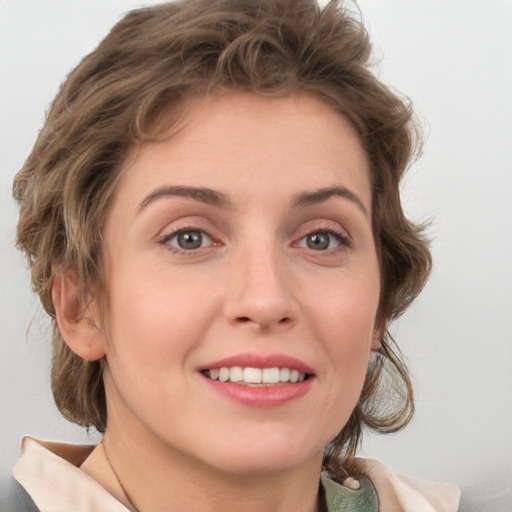 Joyful white young-adult female with medium  brown hair and green eyes