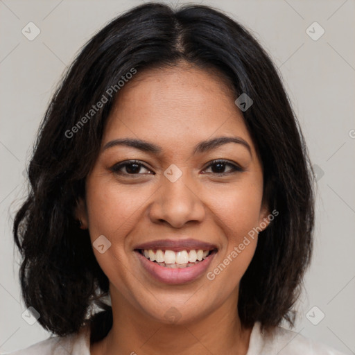 Joyful latino young-adult female with medium  brown hair and brown eyes