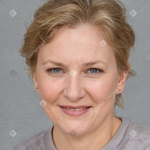 Joyful white adult female with medium  brown hair and blue eyes