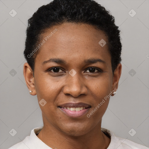 Joyful black young-adult female with short  black hair and brown eyes