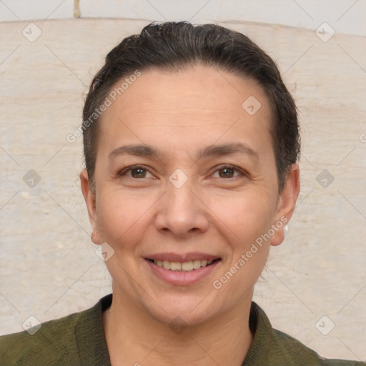 Joyful white adult female with short  brown hair and brown eyes