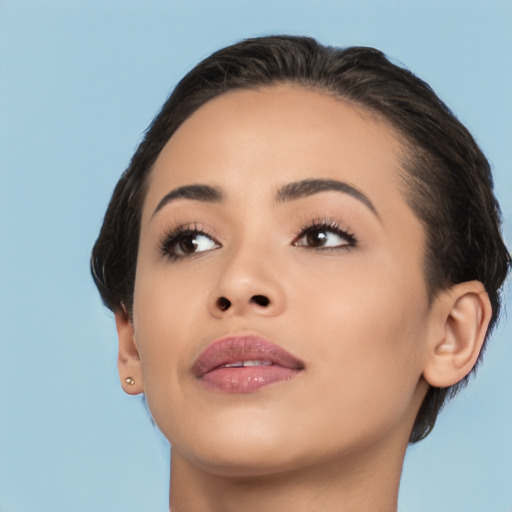 Joyful latino young-adult female with short  brown hair and brown eyes