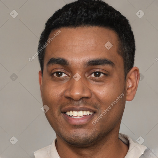 Joyful black young-adult male with short  black hair and brown eyes