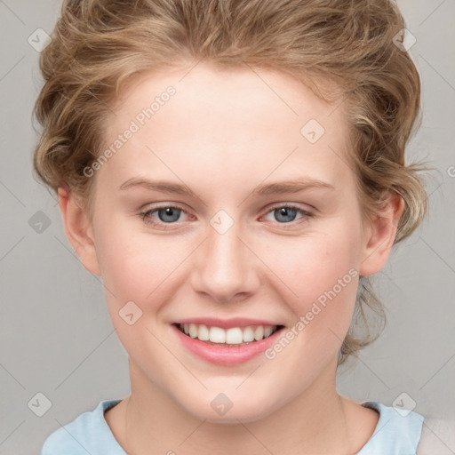 Joyful white young-adult female with medium  brown hair and blue eyes