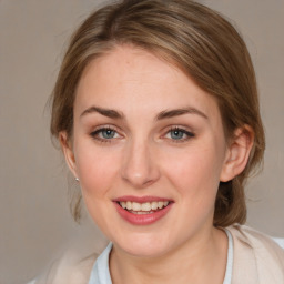 Joyful white young-adult female with medium  brown hair and blue eyes