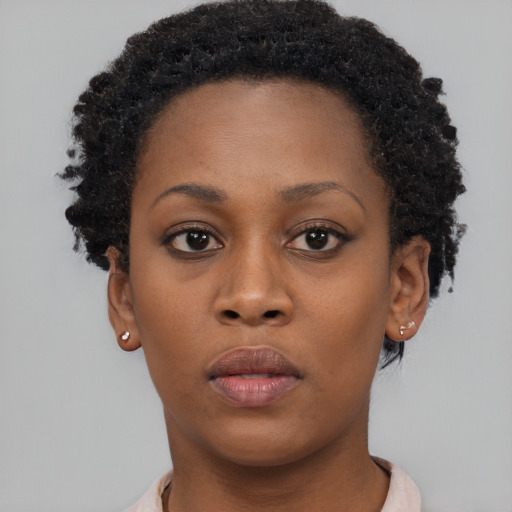 Neutral black young-adult female with short  brown hair and brown eyes