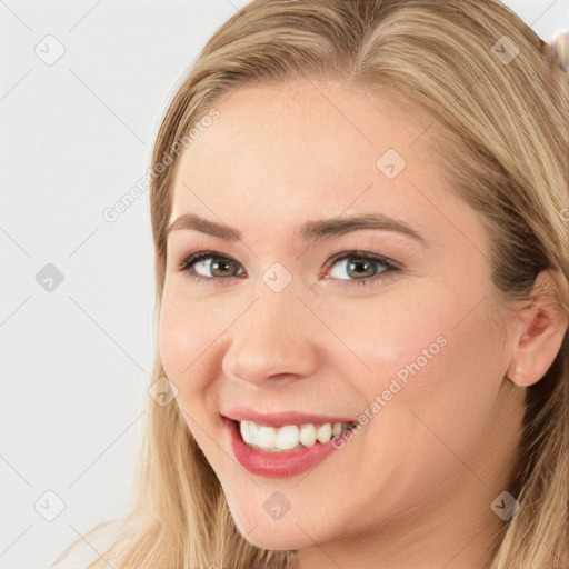 Joyful white young-adult female with long  brown hair and blue eyes