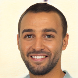 Joyful white young-adult male with short  black hair and brown eyes