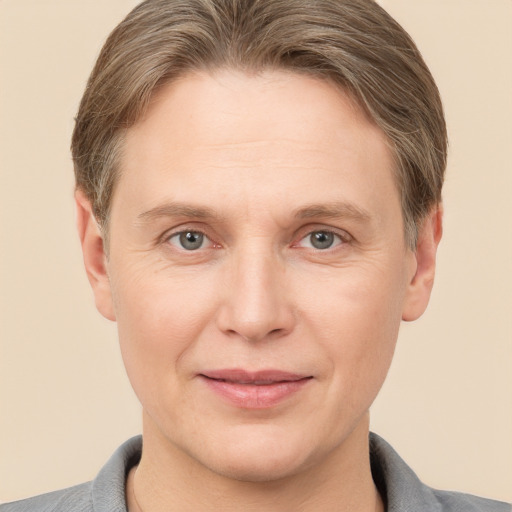 Joyful white adult male with short  brown hair and grey eyes