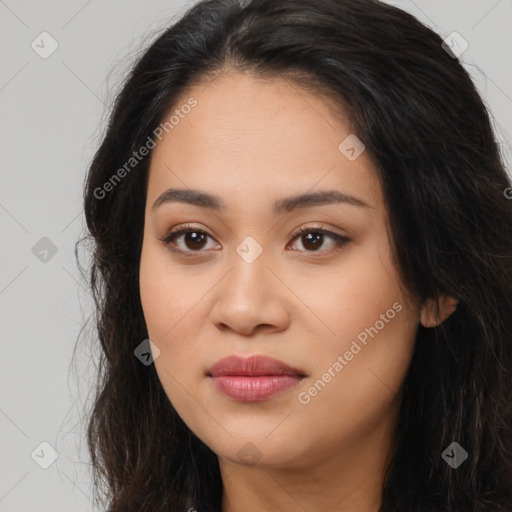 Joyful latino young-adult female with long  brown hair and brown eyes