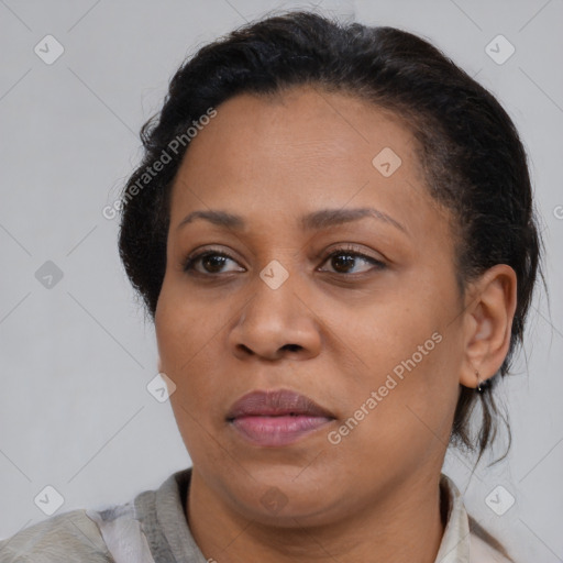Joyful black young-adult female with medium  brown hair and brown eyes