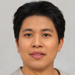 Neutral asian young-adult male with short  brown hair and brown eyes