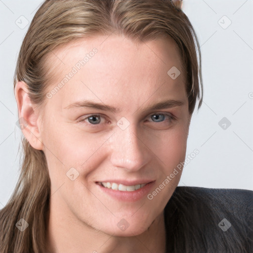 Joyful white young-adult female with long  brown hair and blue eyes