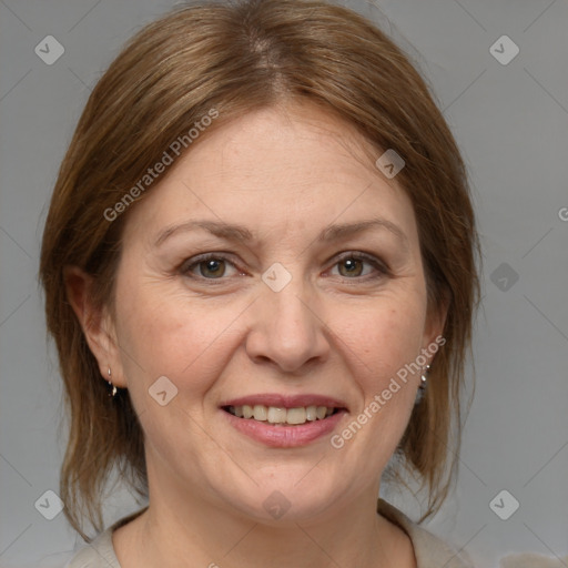 Joyful white adult female with medium  brown hair and brown eyes