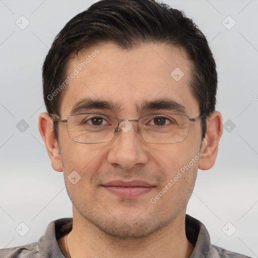 Joyful white adult male with short  brown hair and brown eyes