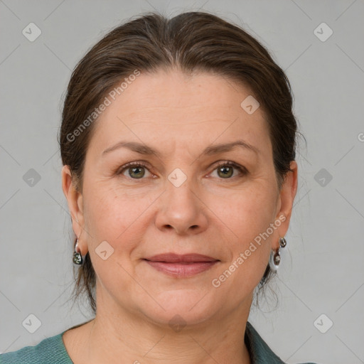 Joyful white adult female with medium  brown hair and grey eyes