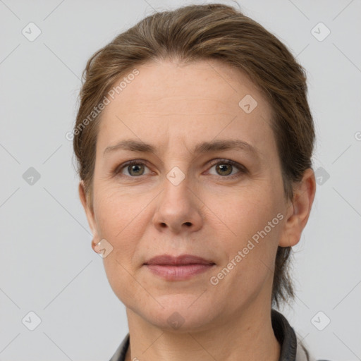 Joyful white adult female with short  brown hair and grey eyes