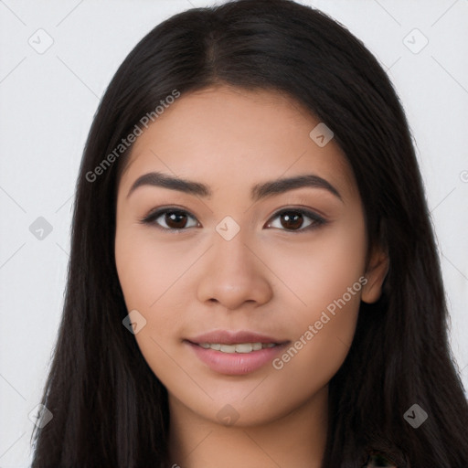 Joyful latino young-adult female with long  black hair and brown eyes