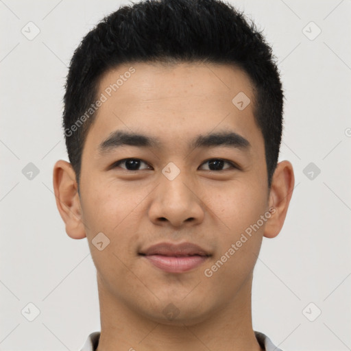 Joyful latino young-adult male with short  brown hair and brown eyes