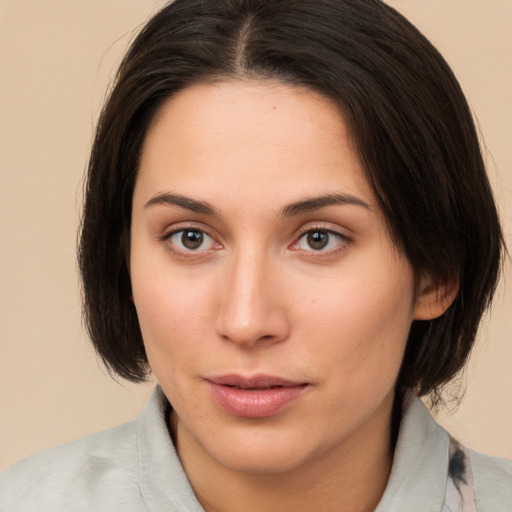 Neutral white young-adult female with medium  brown hair and brown eyes