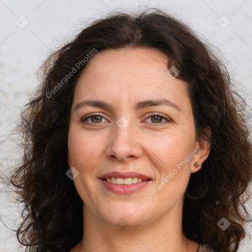 Joyful white adult female with long  brown hair and brown eyes