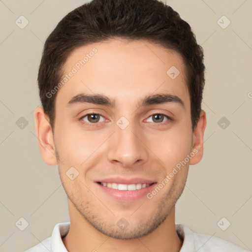 Joyful white young-adult male with short  brown hair and brown eyes