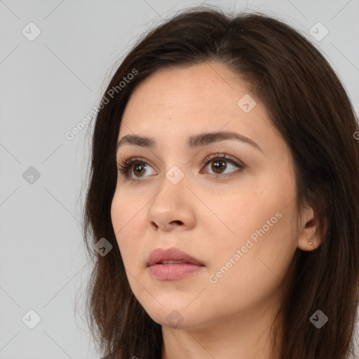 Neutral white young-adult female with long  brown hair and brown eyes