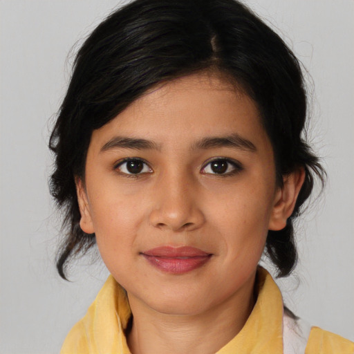 Joyful asian young-adult female with medium  black hair and brown eyes