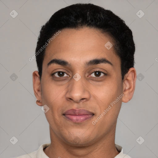 Joyful latino young-adult male with short  black hair and brown eyes