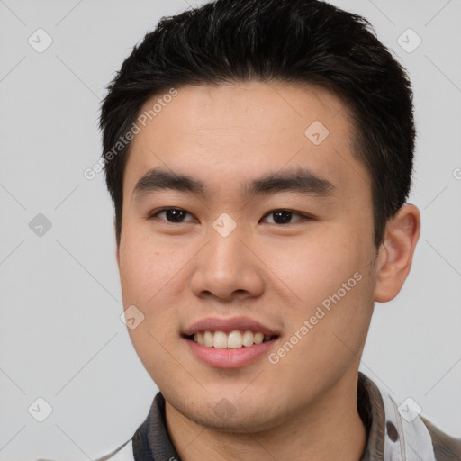 Joyful white young-adult male with short  black hair and brown eyes