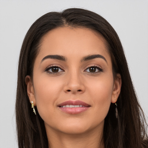 Joyful white young-adult female with long  brown hair and brown eyes