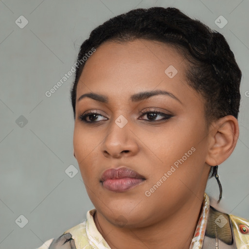 Joyful black young-adult female with short  black hair and brown eyes