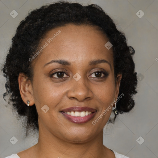 Joyful black adult female with medium  brown hair and brown eyes