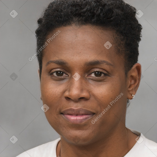 Joyful black young-adult female with short  brown hair and brown eyes