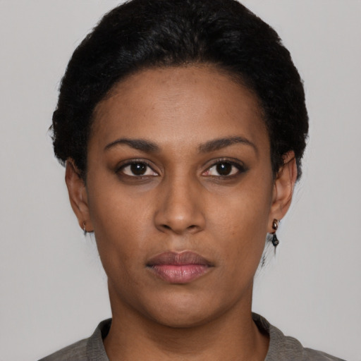 Neutral black young-adult female with short  black hair and brown eyes