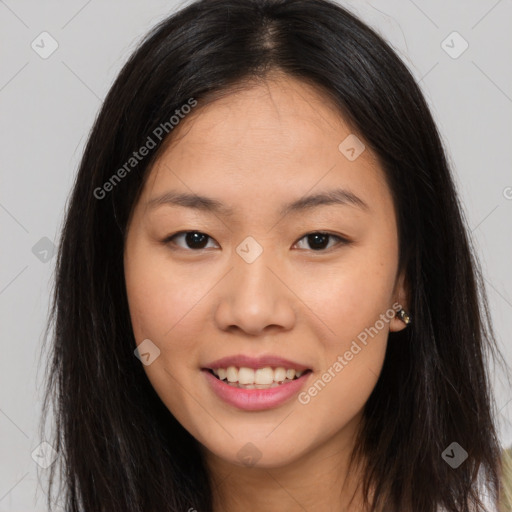 Joyful asian young-adult female with long  brown hair and brown eyes