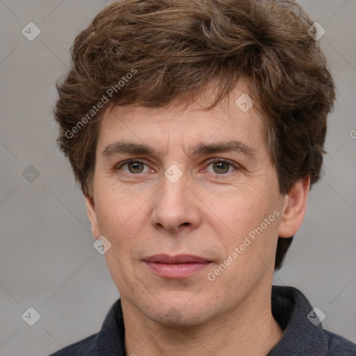 Joyful white adult male with short  brown hair and grey eyes