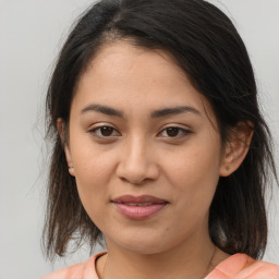 Joyful white young-adult female with medium  brown hair and brown eyes