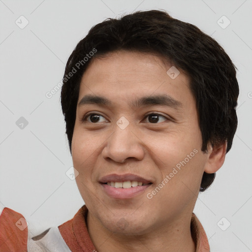 Joyful white young-adult male with short  black hair and brown eyes