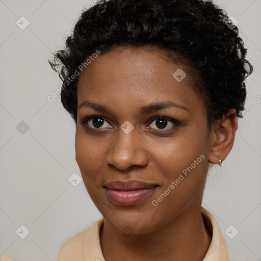 Joyful black young-adult female with short  brown hair and brown eyes