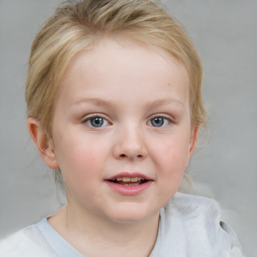 Joyful white child female with medium  brown hair and blue eyes