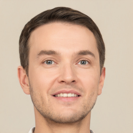 Joyful white young-adult male with short  brown hair and brown eyes