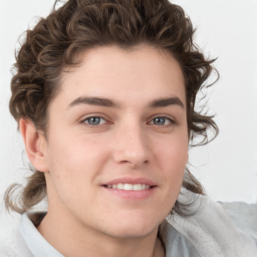 Joyful white young-adult male with medium  brown hair and brown eyes