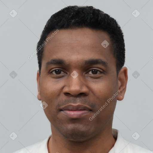 Neutral black young-adult male with short  black hair and brown eyes