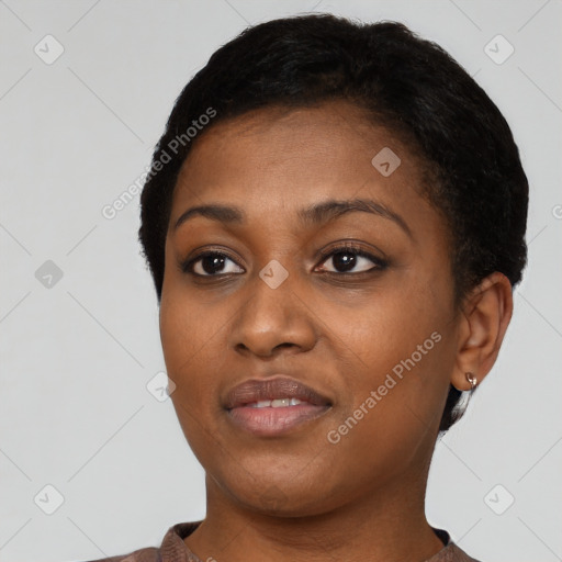 Joyful black young-adult female with short  black hair and brown eyes